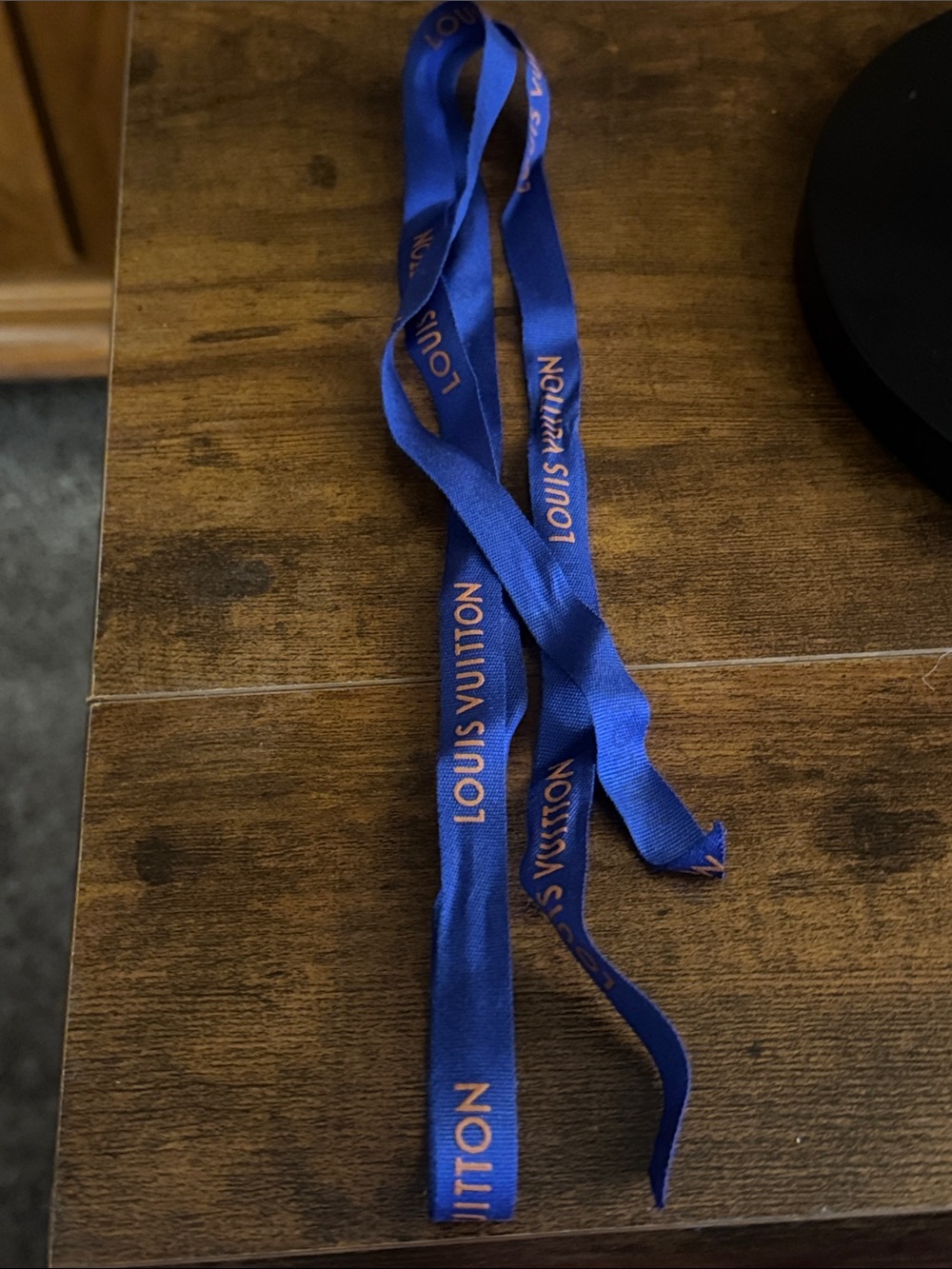 Louis Vuitton cobalt blue ribbon with orange logo
